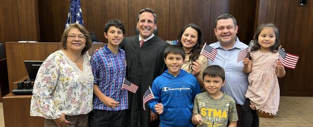 Naturalization ceremony with Judge Micko and Naturalized citizens