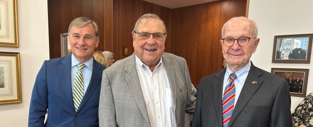 U.S. District Judge David Doty alongside colleagues during a court ceremony.