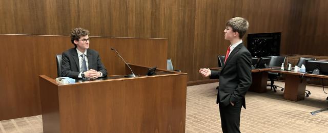 Mock trial competition. Student lawyer questioning witness.